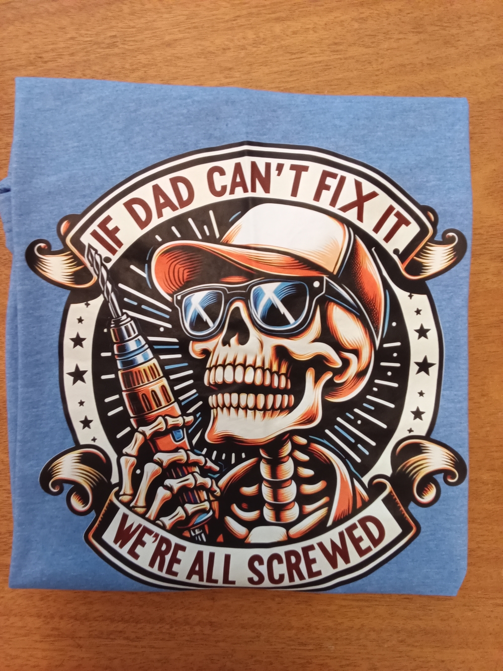 Graphic Skeleton Dad Tee in Light Blue. Brand New Pit - Pit 22" Length 29"